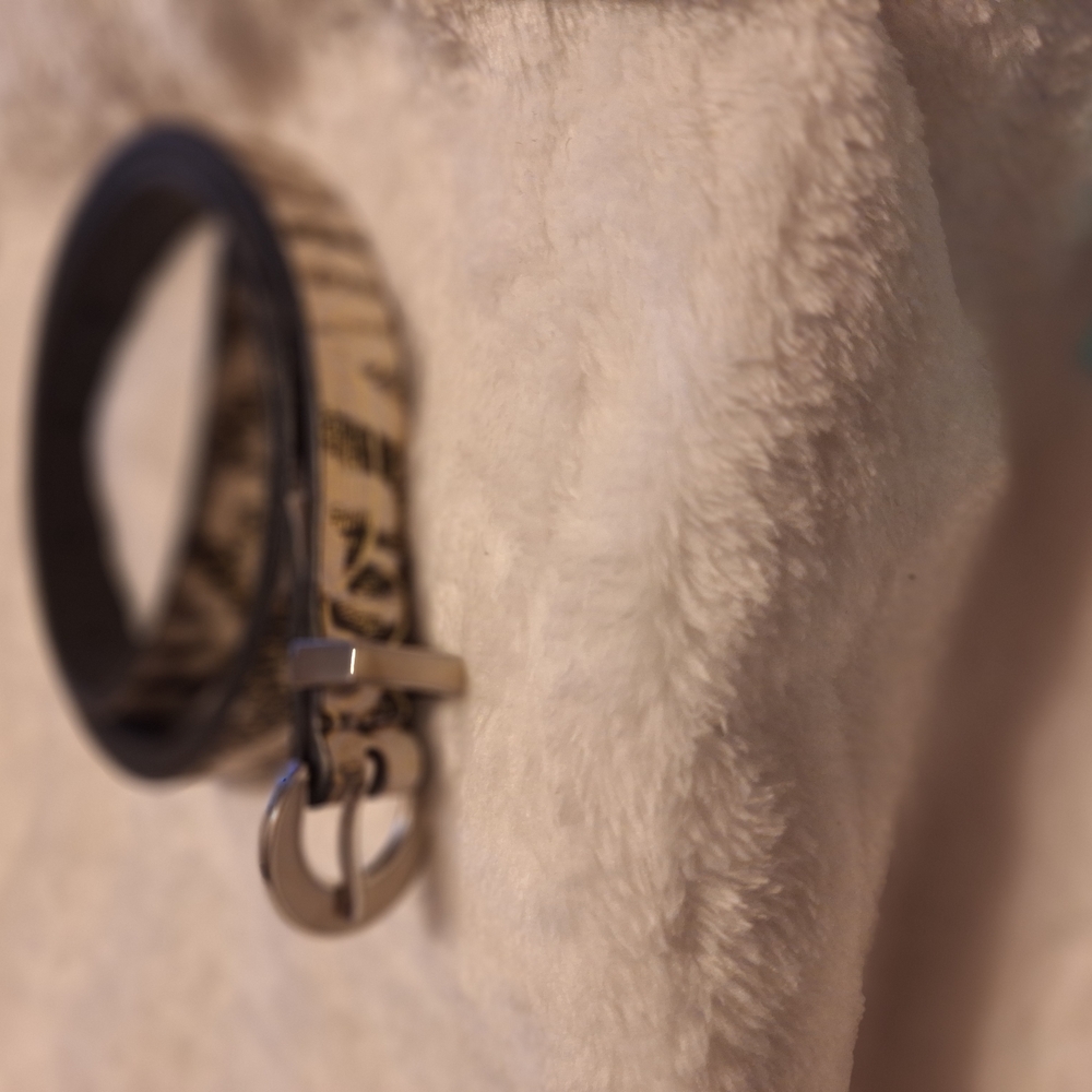 Kenneth Cole Black and Tan Leather Belt with Sleek Metal Buckle